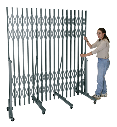 Superior Portable Gates with easy-to-use pressure lock - girl operating portable traffic control gate